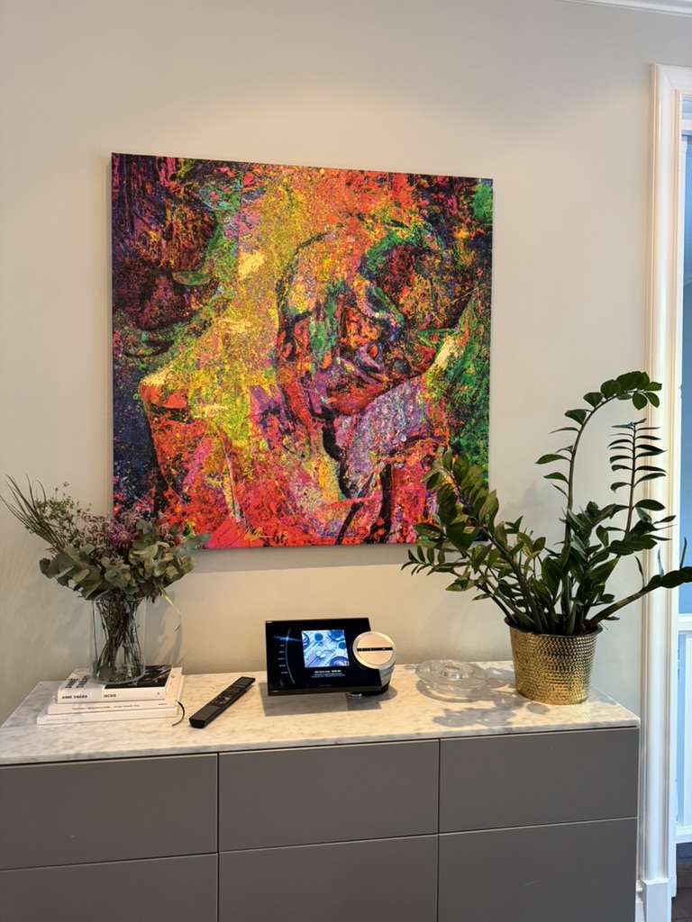 BeoSound 5c in a living room setting with a Beo4 remote